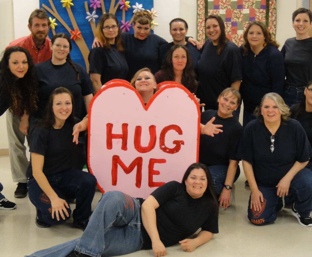 pic of Unconditional Love cast with huge valentine heart that says HUG ME