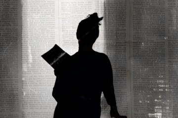 holding script and reading aloud